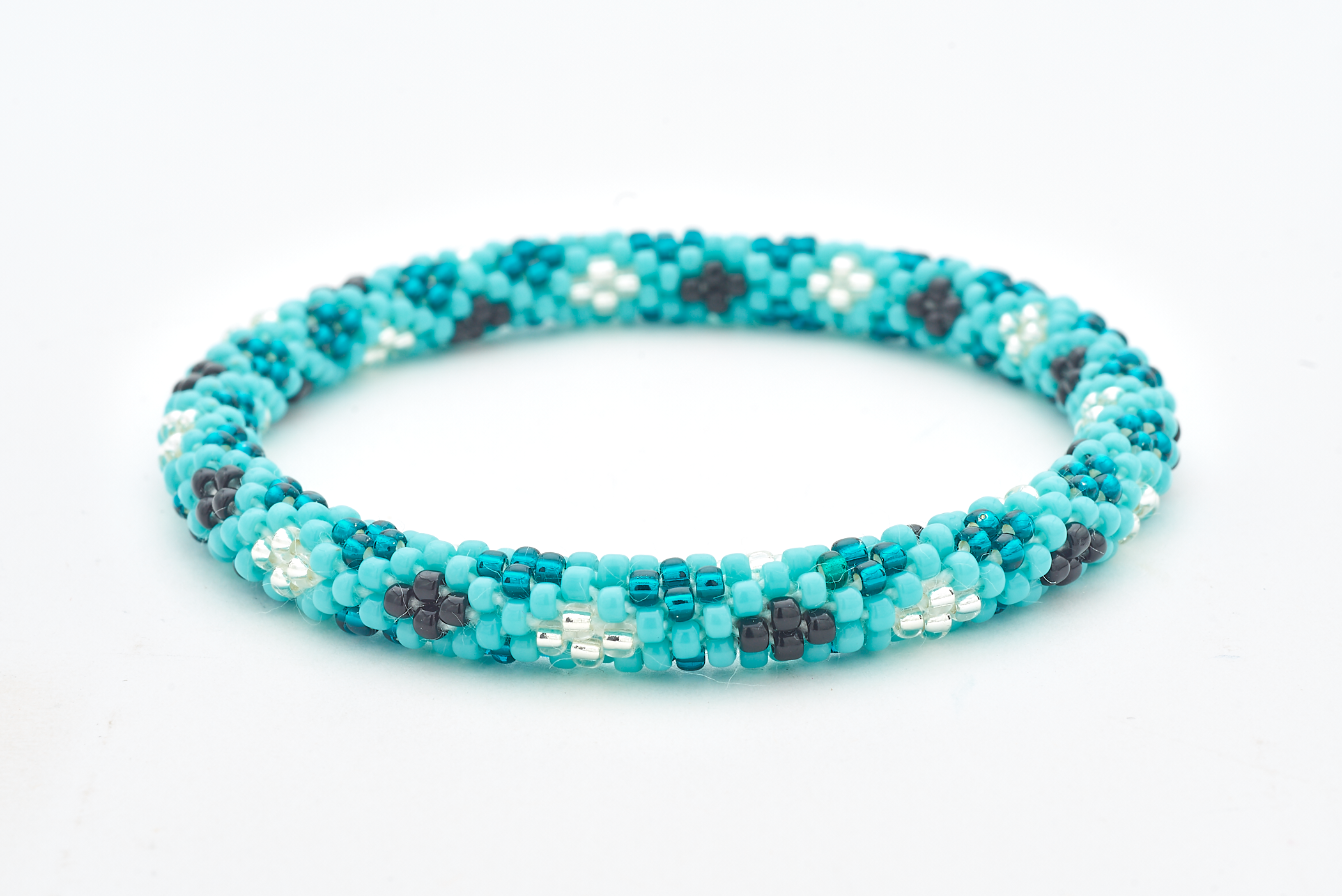 Handmade glass bead bracelet from Nepal, featuring a roll design. Also known as a beaded bracelet, seed bead bracelet, beach glass bracelet, or sea glass bracelet