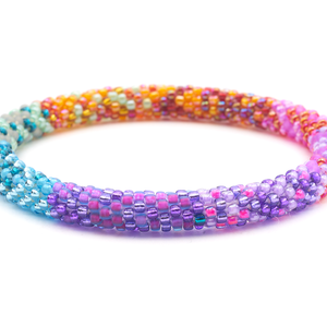 Sashka Co. Mixed Purples, Blues, Gray, Orange, Reds, Pinks Bracelet. Handmade glass bead bracelet from Nepal, featuring a roll design.
 