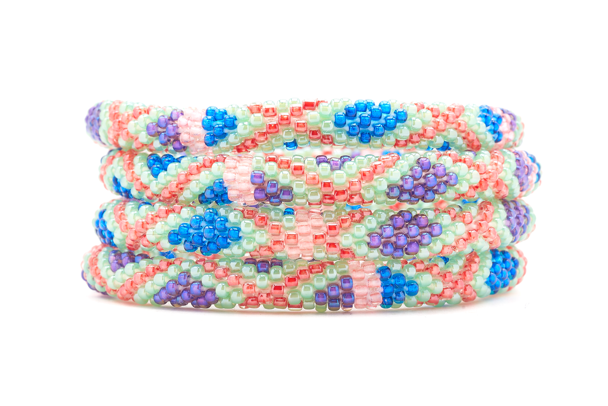 Sashka Co. Mint , Blue , Purple , Red , Coral Bracelet. Handmade glass bead bracelet from Nepal, featuring a roll design.
 