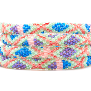 Sashka Co. Mint , Blue , Purple , Red , Coral Bracelet. Handmade glass bead bracelet from Nepal, featuring a roll design.
 