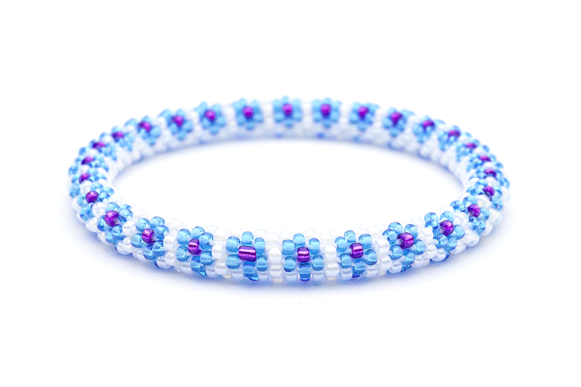Sashka Co. Blue , White , Purple Bracelet. Handmade glass bead bracelet from Nepal, featuring a roll design.
 