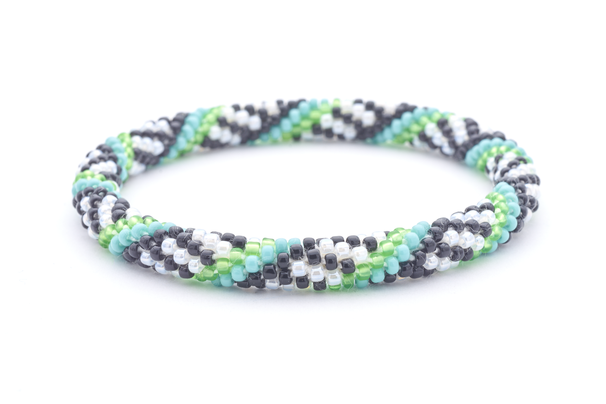 Sashka Co. white, black, green, turquoise Arcadia Bracelet. Handmade glass bead bracelet from Nepal, featuring a roll design.
