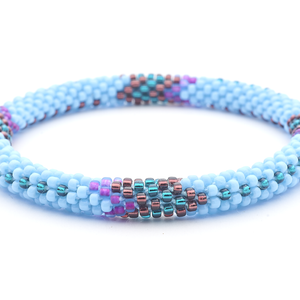 Sashka Co. handmade glass beaded friendship bracelet with baby blue, purple, deep purple, and teal glass beads. Crafted in Nepal by skilled artisans.