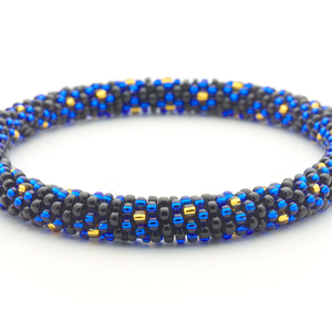 Sashka Co handmade beaded friendship bracelet with black, blue, and gold glass beads. Crafted in Nepal by skilled artisans.