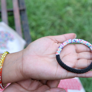 Sashka Co handmade beaded friendship bracelet with black and mixed confetti glass beads in a half-and-half design. Crafted in Nepal by skilled artisans.