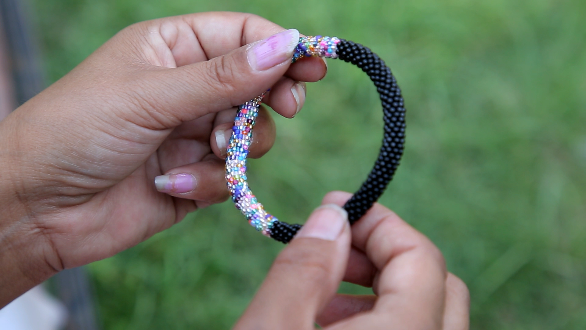 Sashka Co handmade beaded friendship bracelet with black and mixed confetti glass beads in a half-and-half design. Crafted in Nepal by skilled artisans.
