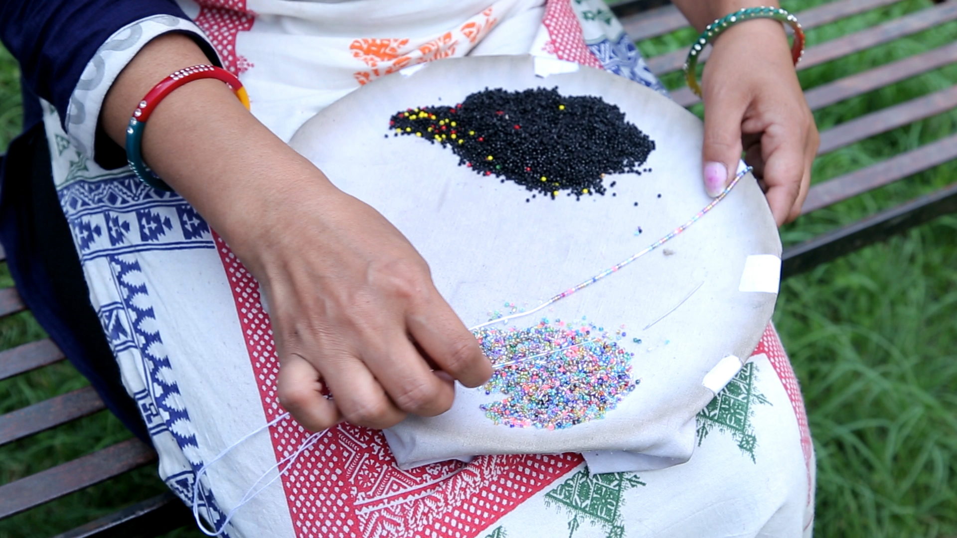 Sashka Co handmade beaded friendship bracelet with black and mixed confetti glass beads in a half-and-half design. Crafted in Nepal by skilled artisans.