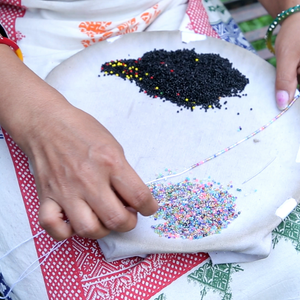 Sashka Co handmade beaded friendship bracelet with black and mixed confetti glass beads in a half-and-half design. Crafted in Nepal by skilled artisans.