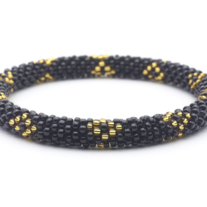 Sashka Co handmade beaded friendship bracelet with black and gold glass beads in a diamond design. Crafted in Nepal by skilled artisans.