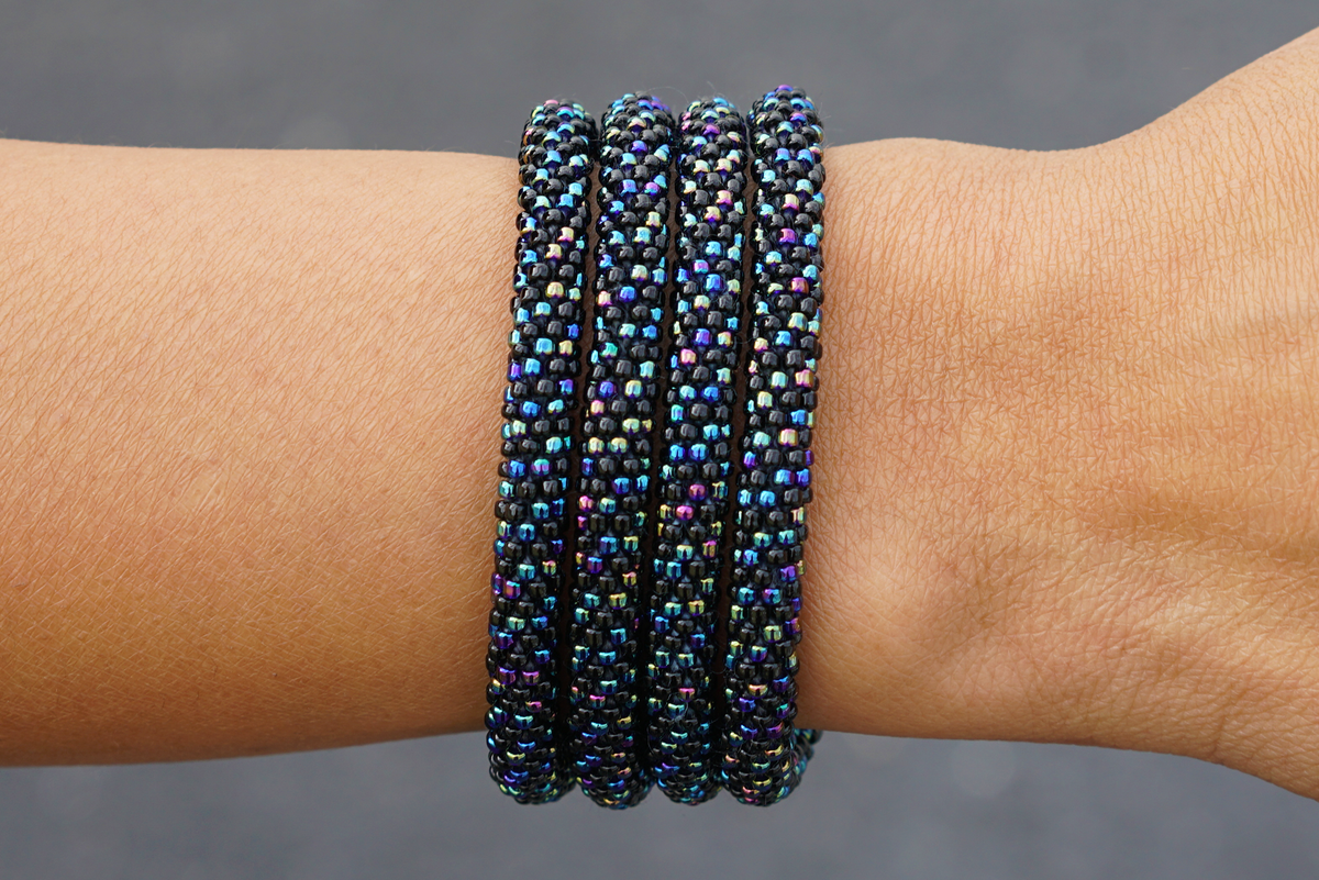 Sashka Co. handmade glass beaded friendship bracelet with black and iridescent glass beads. Crafted in Nepal by skilled artisans.
