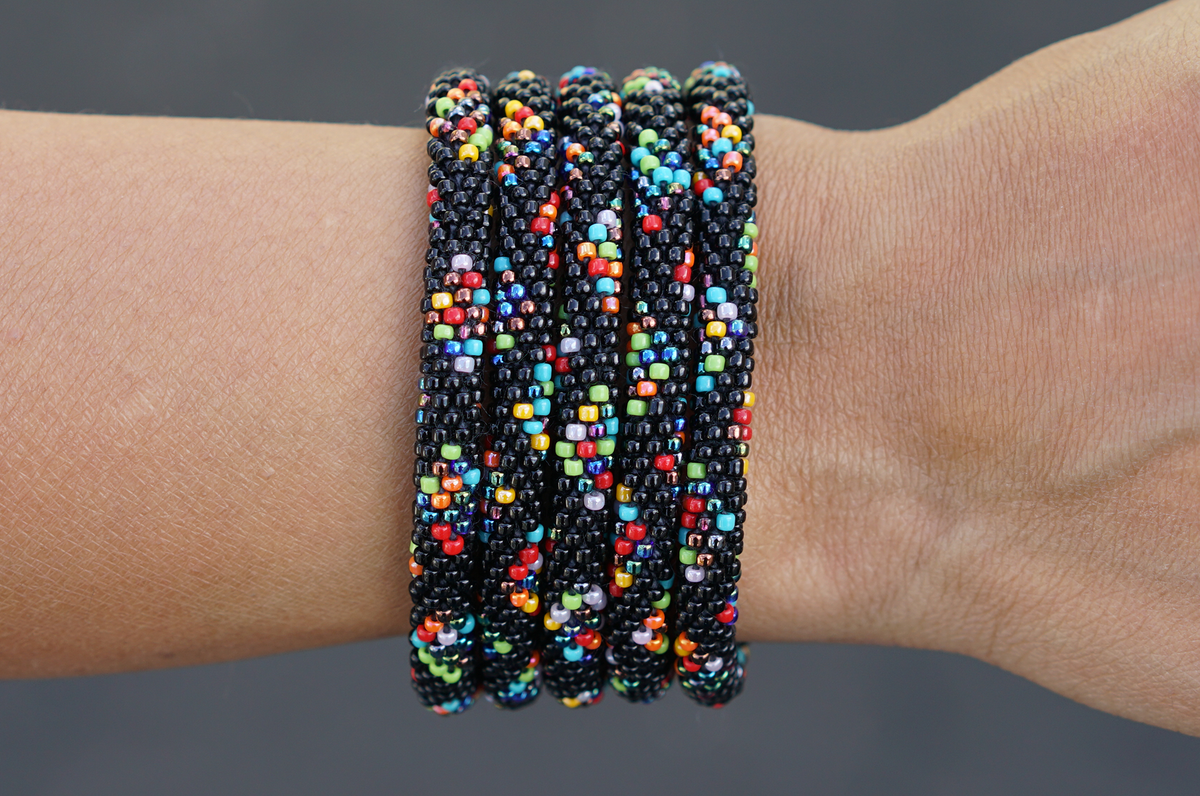 Sashka Co handmade beaded friendship bracelet with black and mixed confetti glass beads in a diamond pattern. Crafted in Nepal by skilled artisans.