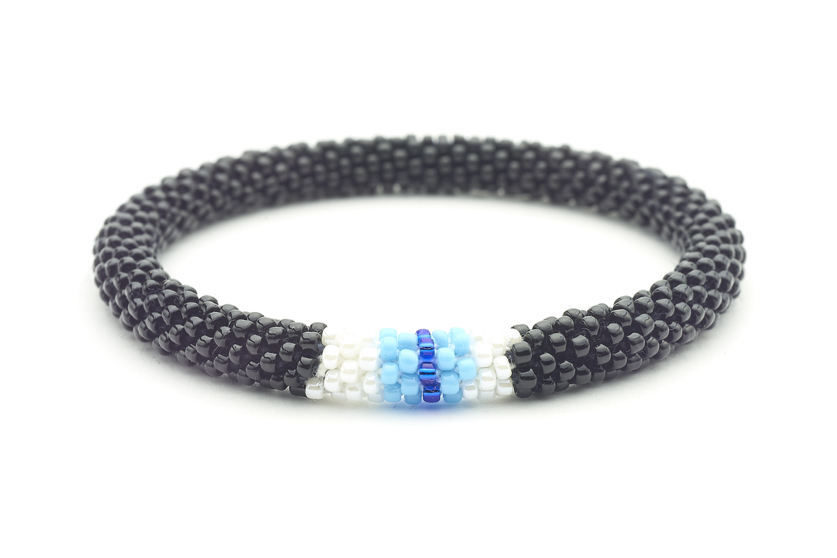 Sashka Co. handmade glass beaded friendship bracelet with black, white, light blue, and blue glass beads in an evil eye pattern. Crafted in Nepal by skilled artisans.