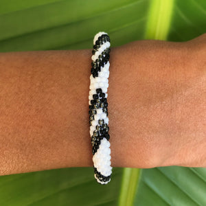 Sashka Co handmade beaded friendship bracelet with black, white, and silver glass beads. Crafted in Nepal by skilled artisans.