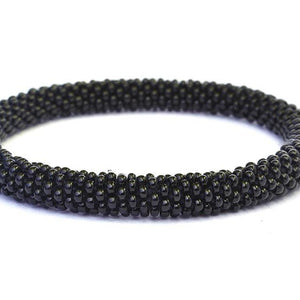 Sashka Co handmade beaded friendship bracelet with solid black glass beads. Crafted in Nepal by skilled artisans.