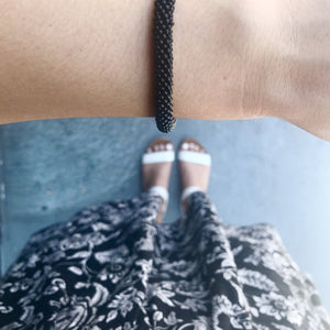 Sashka Co handmade beaded friendship bracelet with solid black glass beads. Crafted in Nepal by skilled artisans.