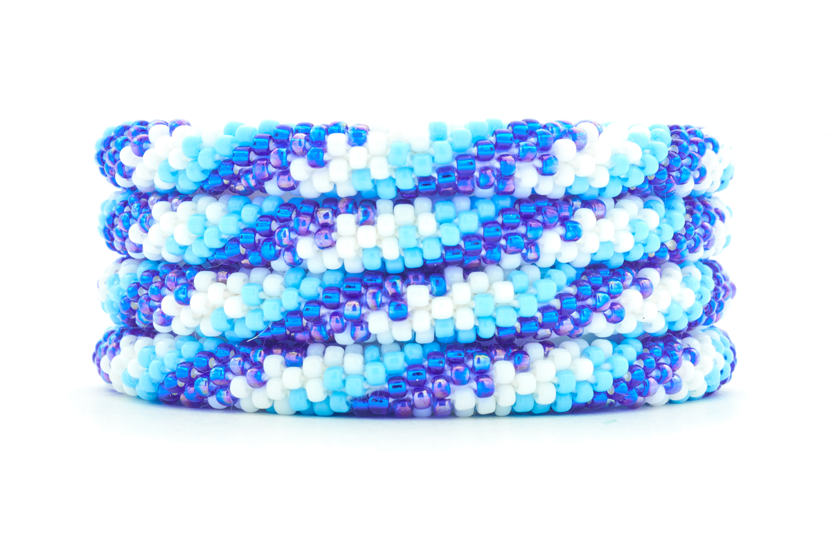 Handmade beaded friendship bracelet with blue, light blue, and white glass beads. Crafted by artisans in Nepal for Sashka Co.