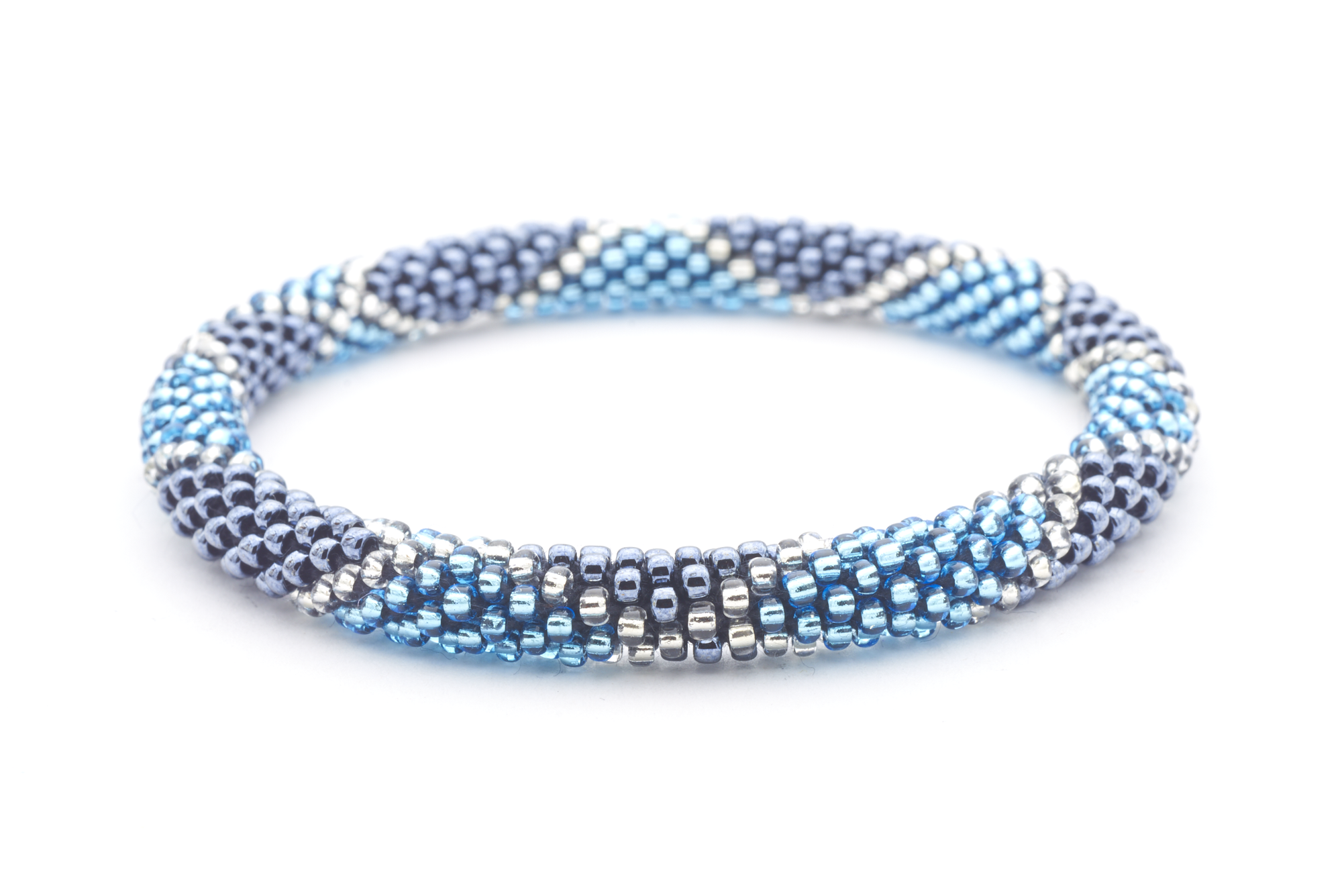 Sashka Co. handmade glass beaded friendship bracelet with blue, silver, and clear glass beads in a diamond pattern. Crafted in Nepal by skilled artisans.