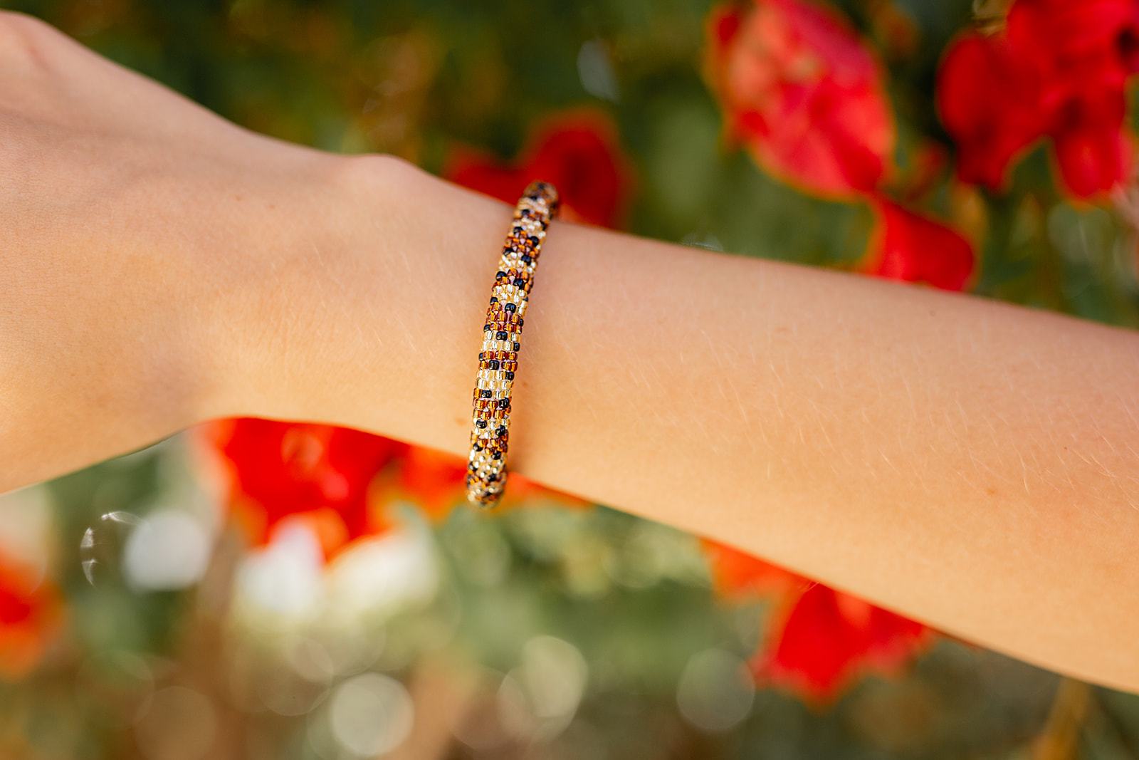 Sashka Co. handmade glass beaded friendship bracelet with brown, gold, and black glass beads. Crafted in Nepal by skilled artisans.