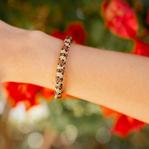 Sashka Co. handmade glass beaded friendship bracelet with brown, gold, and black glass beads. Crafted in Nepal by skilled artisans.