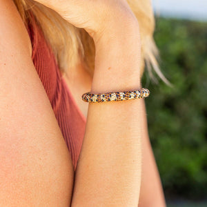 Sashka Co. handmade glass beaded friendship bracelet with brown, gold, and black glass beads. Crafted in Nepal by skilled artisans.