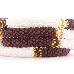 Sashka Co. handmade glass beaded friendship bracelet with brown, white, and gold glass beads in a half and half pattern. Crafted in Nepal by skilled artisans.