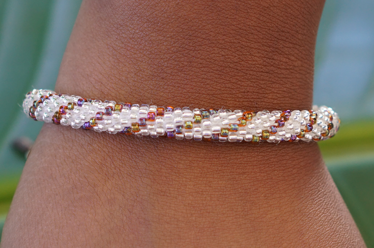 Sashka Co handmade beaded friendship bracelet with clear and iridescent mixed glass beads. Crafted in Nepal by skilled artisans.