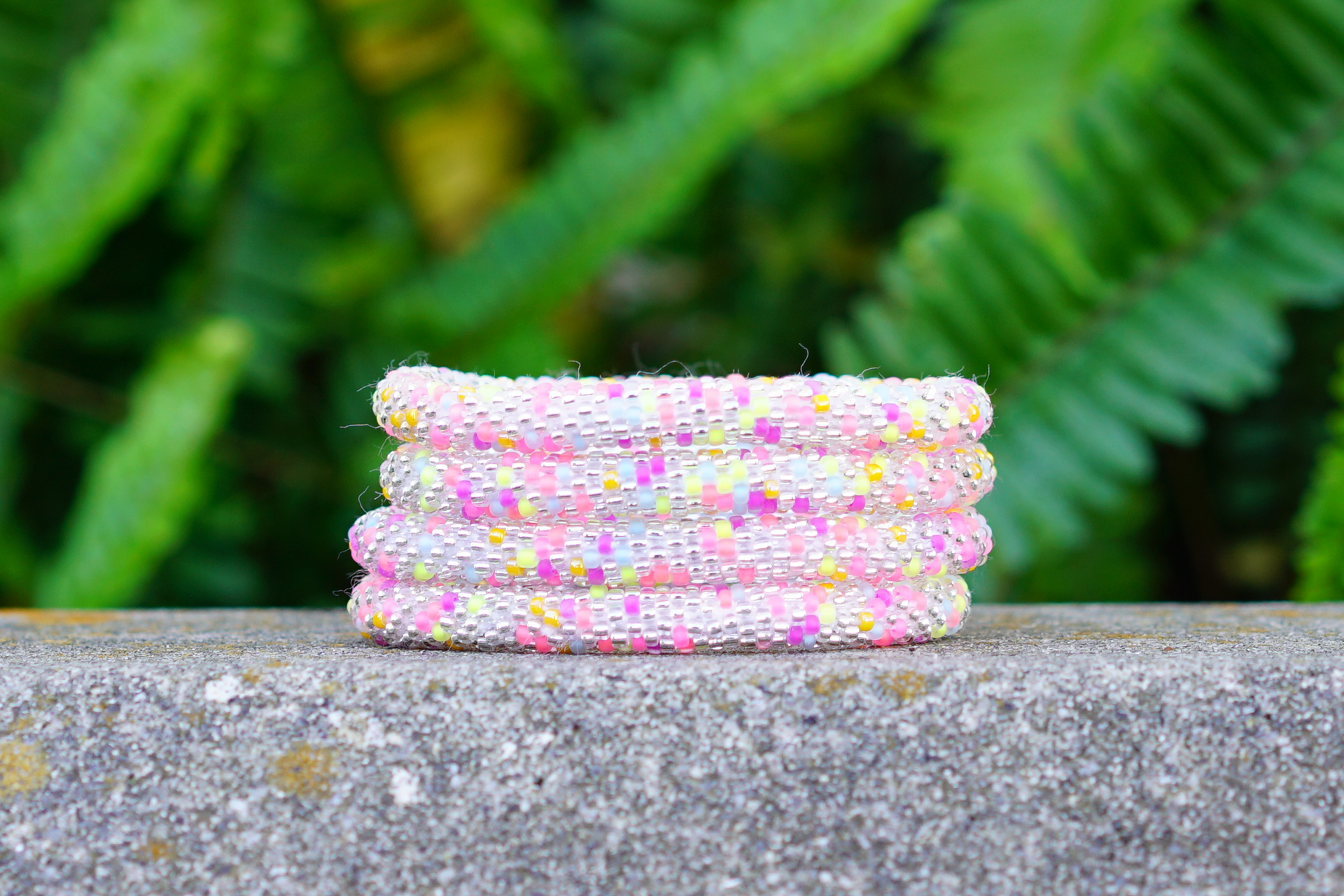 Sashka Co handmade beaded friendship bracelet with clear and neon confetti glass beads. Crafted in Nepal by skilled artisans.