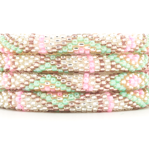 Handmade beaded friendship bracelet with clear, rose gold, purple, pink, and mint glass beads. Crafted by artisans in Nepal for Sashka Co.