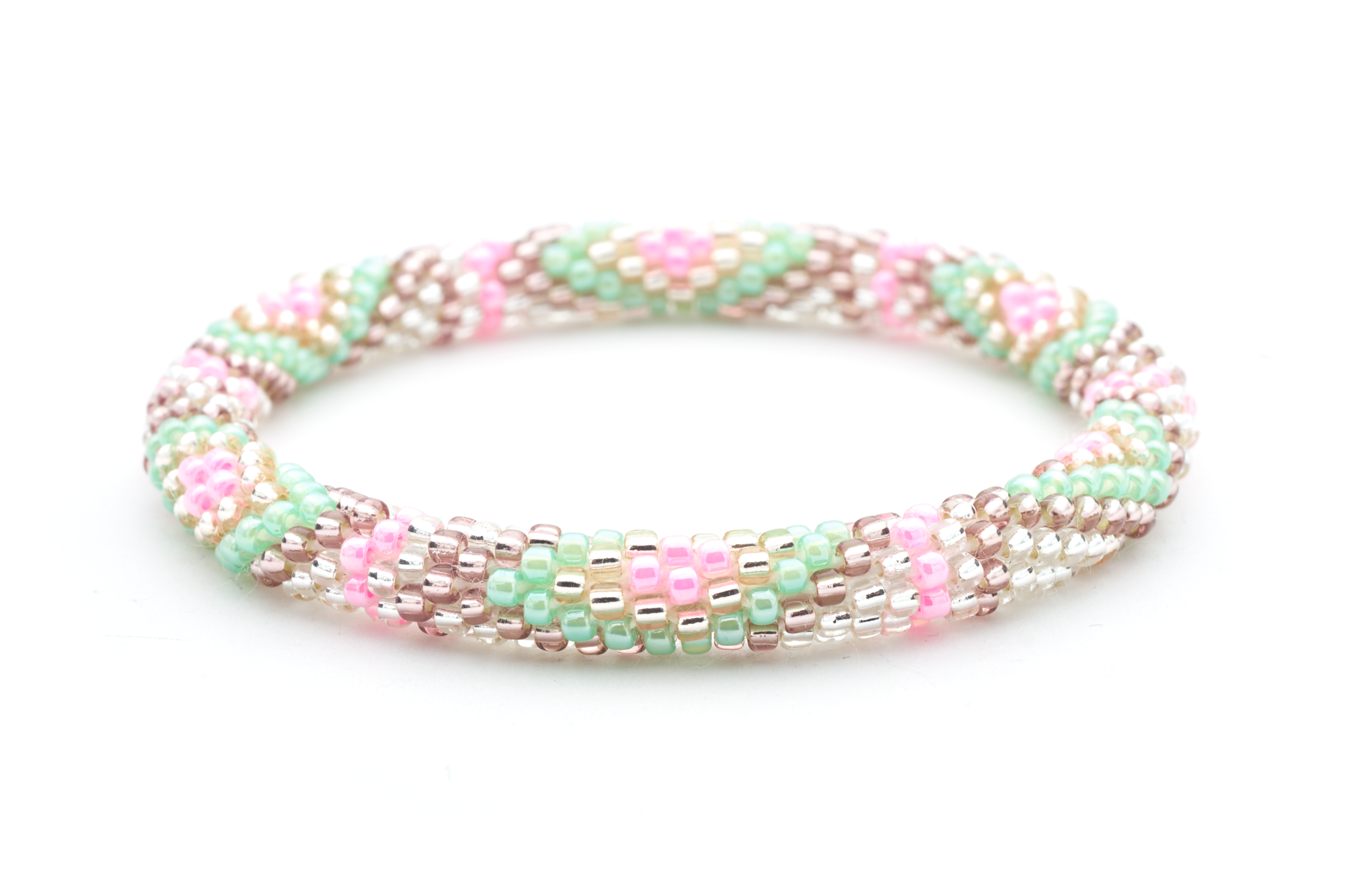 Handmade beaded friendship bracelet with clear, rose gold, purple, pink, and mint glass beads. Crafted by artisans in Nepal for Sashka Co.