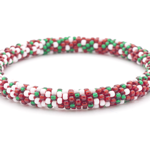 Sashka Co. handmade glass beaded friendship bracelet with a confetti mix of red, white, and green glass beads in a festive holiday pattern. Crafted in Nepal by skilled artisans.