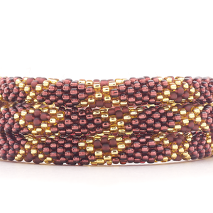 Sashka Co. handmade glass beaded friendship bracelet with gold and plum glass beads in a diamond pattern. Crafted in Nepal by skilled artisans.