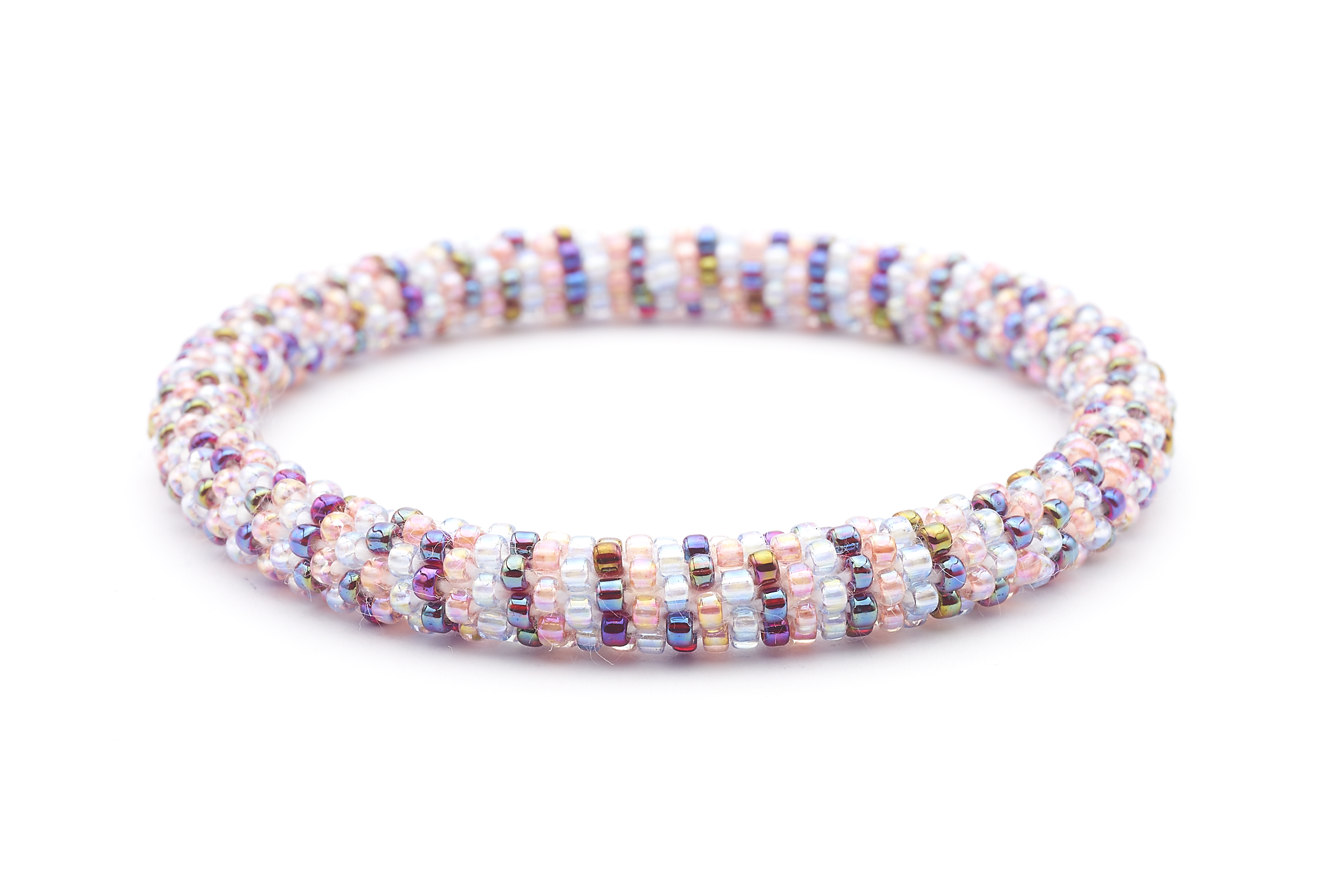 Sashka Co. handmade glass beaded friendship bracelet with iridescent clear, pink, and iridescent red glass beads in a line pattern. Crafted in Nepal by skilled artisans.