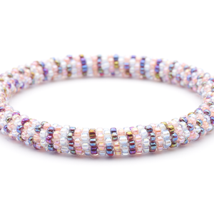 Sashka Co. handmade glass beaded friendship bracelet with iridescent clear, pink, and iridescent red glass beads in a line pattern. Crafted in Nepal by skilled artisans.