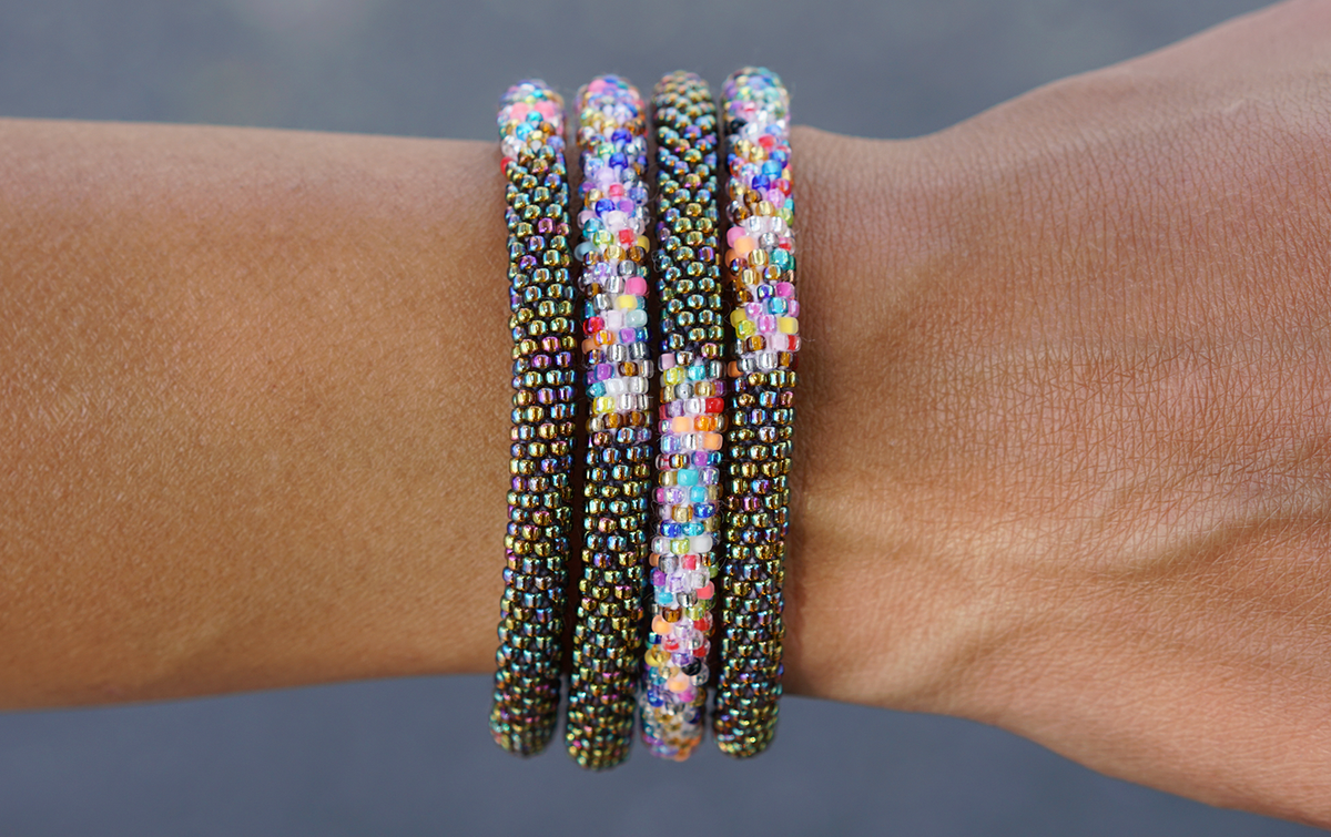 Sashka Co. handmade glass beaded friendship bracelet with iridescent glass beads and a confetti mix in a half-and-half pattern. Crafted in Nepal by skilled artisans.