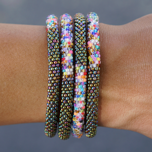 Sashka Co. handmade glass beaded friendship bracelet with iridescent glass beads and a confetti mix in a half-and-half pattern. Crafted in Nepal by skilled artisans.