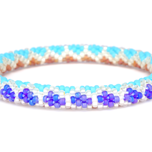Sashka Co. handmade glass beaded friendship bracelet with iridescent matte blue, matte brown, clear, and baby blue glass beads. Crafted in Nepal by skilled artisans.