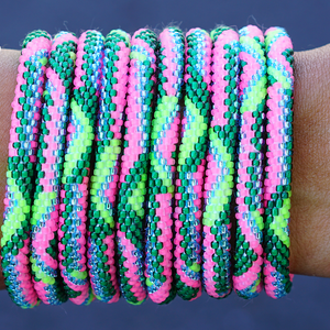 Sashka Co handmade beaded friendship bracelet with matte neon pink, green, matte neon green, and clean blue glass beads. Crafted in Nepal by skilled artisans.