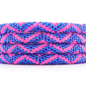 Handmade beaded friendship bracelet with matte pink and blue glass beads. Crafted by artisans in Nepal for Sashka Co.