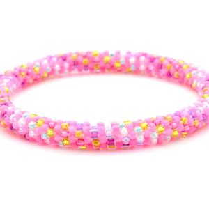 Sashka Co handmade beaded friendship bracelet with matte pink and rainbow confetti glass beads. Crafted in Nepal by skilled artisans.