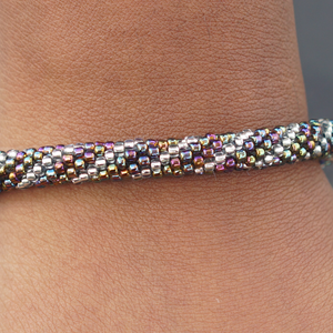 Sashka Co handmade beaded friendship bracelet with mixed iridescent and clear glass beads. Crafted in Nepal by skilled artisans.