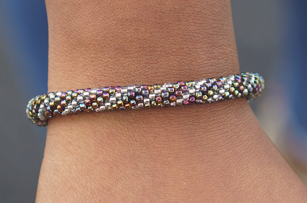 Sashka Co handmade beaded friendship bracelet with mixed iridescent and clear glass beads. Crafted in Nepal by skilled artisans.