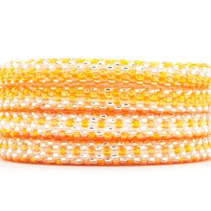 Sashka Co handmade beaded friendship bracelet with orange and clear glass beads. Crafted in Nepal by skilled artisans.