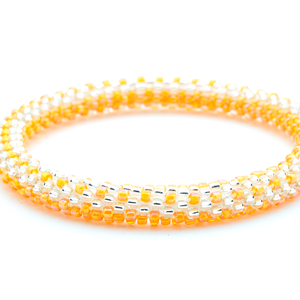 Sashka Co handmade beaded friendship bracelet with orange and clear glass beads. Crafted in Nepal by skilled artisans.