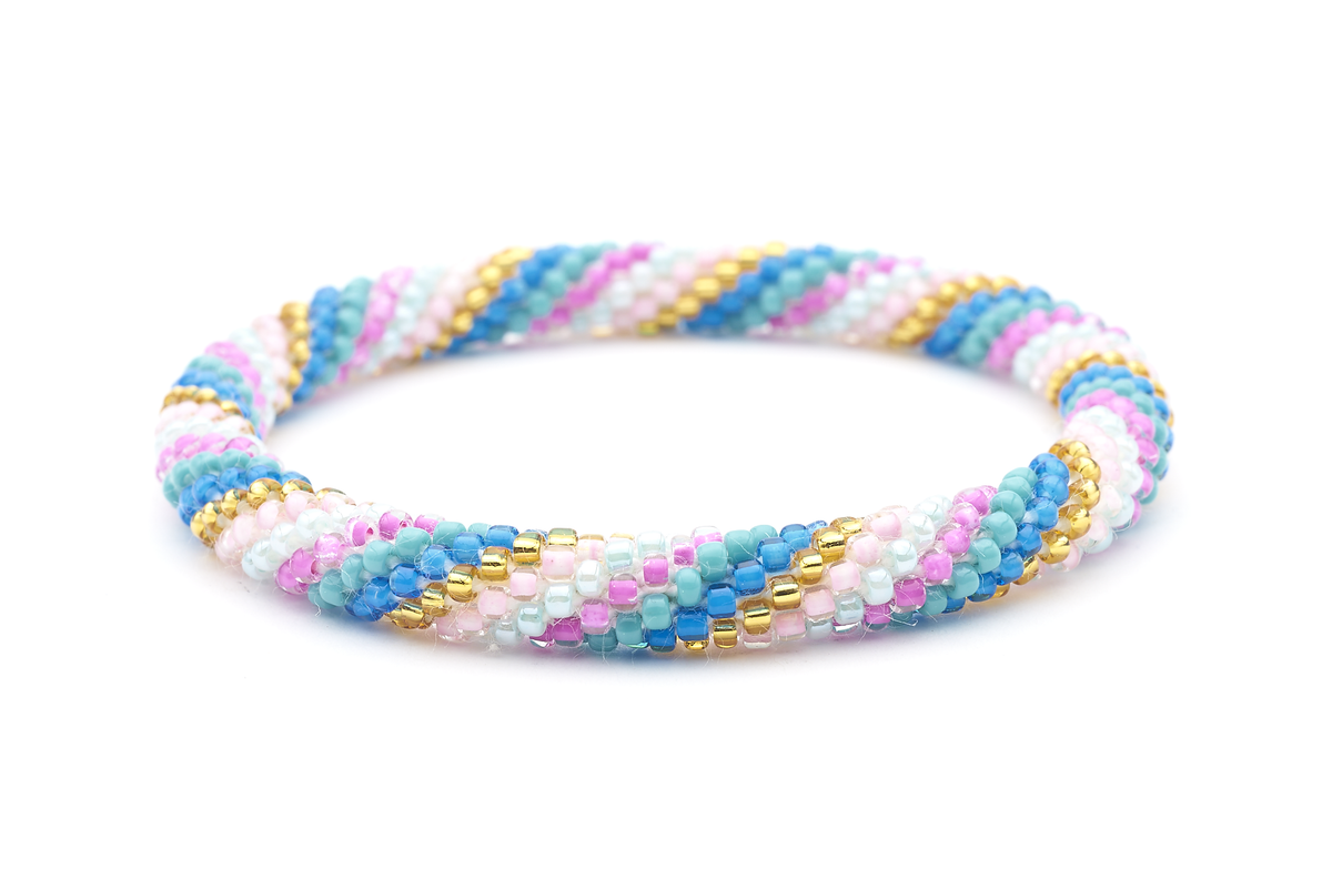 Sashka Co. handmade beaded friendship bracelet with pink, blue, gold, and turquoise glass beads in a spiral pattern. Crafted in Nepal by skilled artisans.