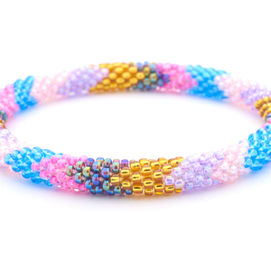 Sashka Co handmade beaded friendship bracelet with Pink , Blue , Purple , Light Pink , Gold , Iridescent  glass beads. Crafted in Nepal by skilled artisans.
 
 