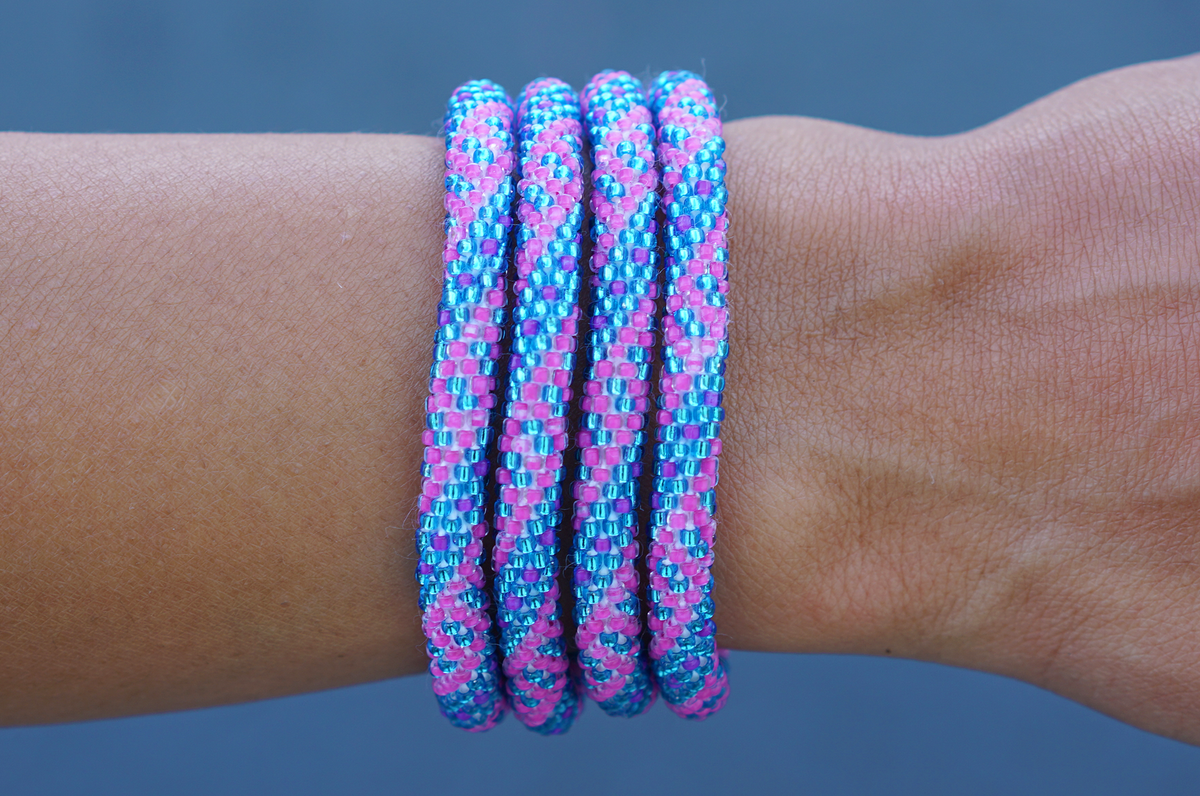 Sashka Co. handmade glass beaded friendship bracelet with pink and blue glass beads. Crafted in Nepal by skilled artisans.