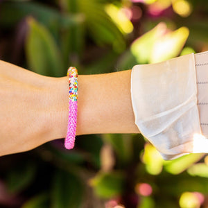 Sashka Co. handmade beaded friendship bracelet with half solid pink beads and half multicolor confetti beads. Crafted in Nepal by skilled artisans.