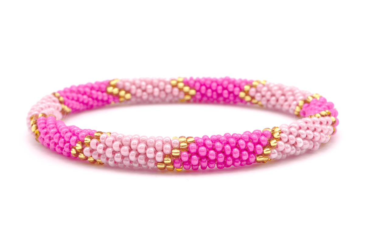 Sashka Co. handmade glass beaded friendship bracelet with pink, light pink, and gold glass beads in a chevron pattern. Crafted in Nepal by skilled artisans.