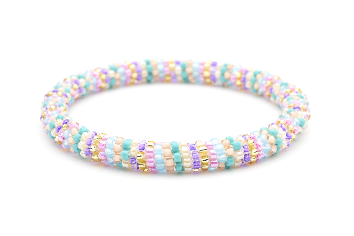 Sashka Co handmade beaded friendship bracelet with pink, turquoise, gold, and purple glass beads. Crafted in Nepal by skilled artisans.