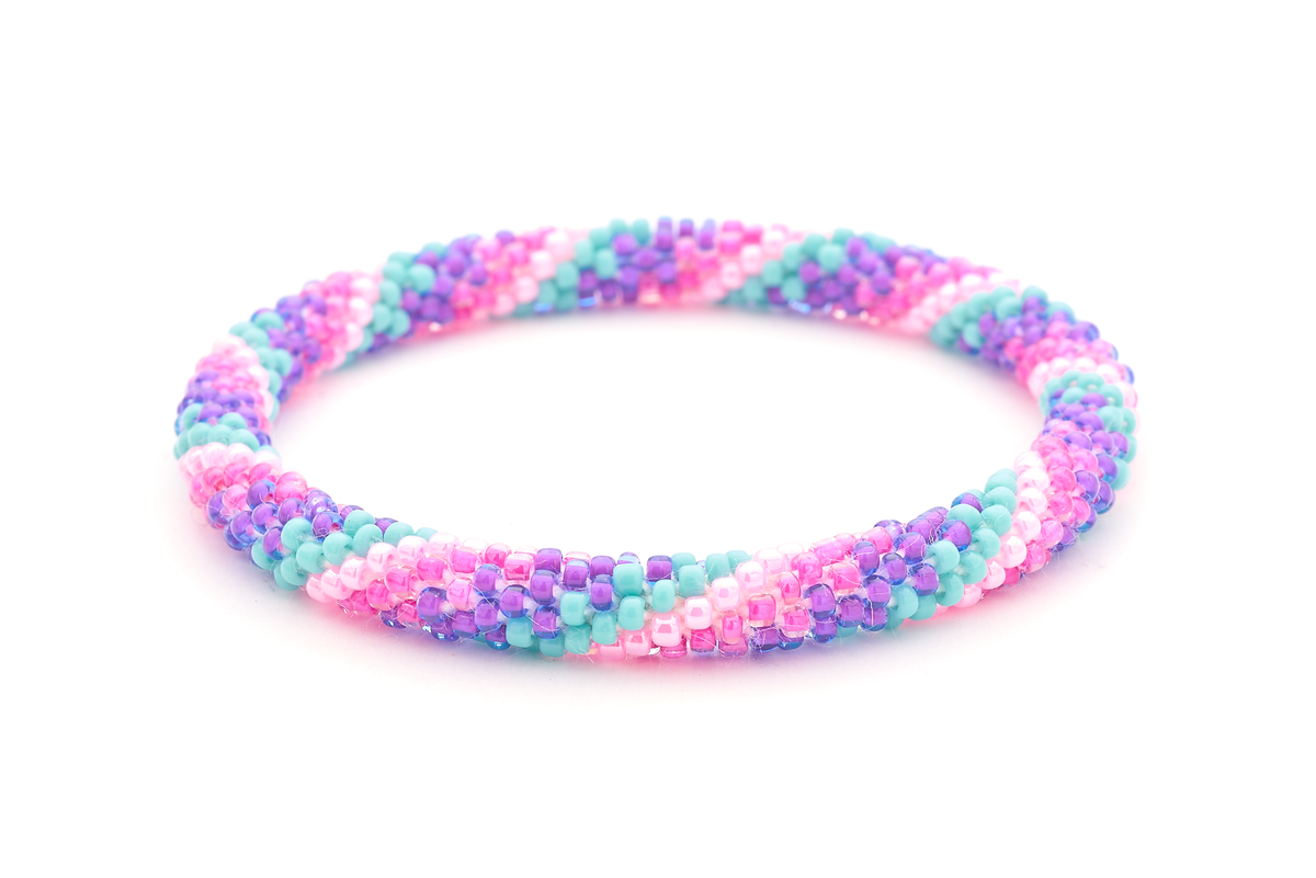 Sashka Co. handmade beaded friendship bracelet with purple, turquoise, and pink glass beads. Crafted in Nepal by skilled artisans in a spiral pattern.